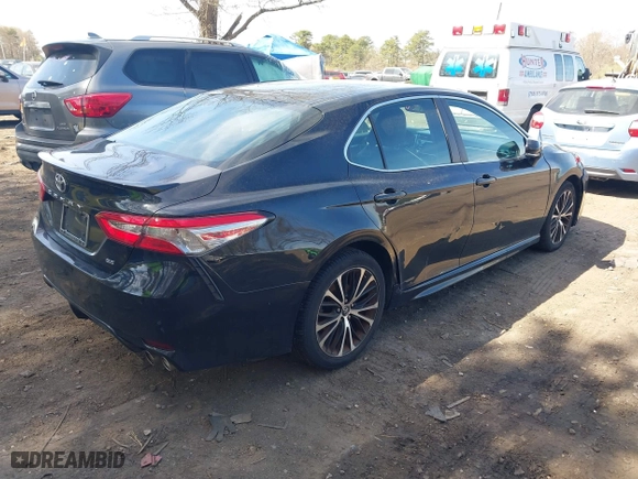 2018 Toyota Camry LE with VIN 4T1B11HK9JU115557, listed as a IAAI auction lot 42087452 with 185,752 mi miles. Bid and sale history available at carsss.com. Image 4.