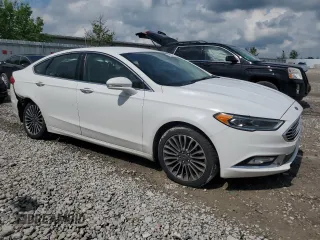 2017 Ford Fusion SE z VIN 3FA6P0H92HR203496, wystawiony jako Copart lot #56719365 z przebiegiem 99 817 mil mil oraz Szkoda całkowita • Salvage title. Historia ofert i sprzedaży dostępna na DreamBid. Obrazek 4.