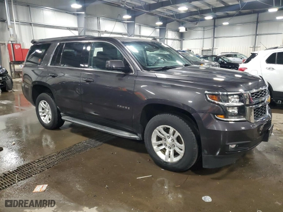 2015 Chevrolet Tahoe LT with VIN 1GNSKBKCXFR126500, listed as a Copart auction lot 49814255 with 106,714 mi miles and Salvage Title. Bid and sale history available at carsss.com. Image 4.