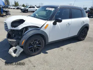 2013 MINI Countryman with VIN WMWZB3C50DWM07813, listed as a Copart auction lot 58262735 with 124,650 mi miles and Salvage title. Bid and sale history available at DreamBid. Image 1.