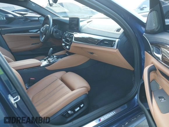2021 BMW 5 Series M550i xDrive z VIN WBA13BK0XMCG75802, wystawiony jako IAAI lot #41503977 z przebiegiem 20 741 mil mil oraz . Historia ofert i sprzedaży dostępna na DreamBid. Obrazek 5.