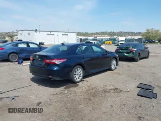 2019 Toyota Camry LE with VIN 4T1B11HK6KU276644, listed as a IAAI auction lot 42037249 with 23,677 mi miles and . Bid and sale history available at DreamBid. Image 4.