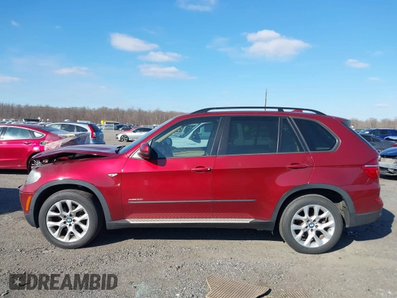 2011 BMW X5 35i with VIN 5UXZV4C52BL413125, listed as a IAAI auction lot 41697824 with 136,828 mi miles. Bid and sale history available at carsss.com. Image 14.