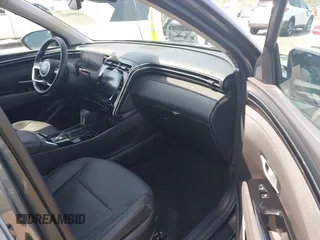 2022 Hyundai Tucson SEL z VIN 5NMJCCAE4NH096813, wystawiony jako IAAI lot #41899641 z przebiegiem 23 668 mil mil oraz . Historia ofert i sprzedaży dostępna na DreamBid. Obrazek 5.