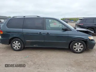 2003 Honda Odyssey EX-L z VIN 5FNRL18053B133092, wystawiony jako IAAI lot #42365081 z przebiegiem 239 753 mil mil oraz . Historia ofert i sprzedaży dostępna na DreamBid. Obrazek 13.