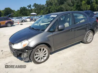 2011 Suzuki SX4 LE with VIN JS2YC5A27B6304410, listed as a Copart auction lot 72119824 with 118,357 mi miles and Salvage Title. Bid and sale history available at carsss.com. Image 1.