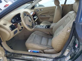 2007 Jaguar XK with VIN SAJWA44C779B12243, listed as a Copart auction lot 77239534 with 0 mi miles and Salvage Title. Bid and sale history available at carsss.com. Image 7.