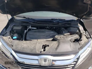 2019 Honda Odyssey Touring z VIN 5FNRL6H87KB098010, wystawiony jako Copart lot #54791505 z przebiegiem 94 477 mil mil oraz Szkoda całkowita • Salvage title. Historia ofert i sprzedaży dostępna na DreamBid. Obrazek 12.