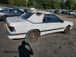 1992 Chrysler LeBaron z VIN 1C3XU553XNF239048, wystawiony jako Copart lot #69465714 z przebiegiem Nie podano mil oraz Tytuł czysty. Historia ofert i sprzedaży dostępna na DreamBid. Obrazek 3.
