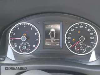 2013 Volkswagen Tiguan SEL with VIN WVGBV3AX1DW595673, listed as a IAAI auction lot 42140263 with 77,457 mi miles and . Bid and sale history available at DreamBid. Image 7.