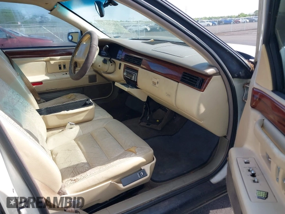 1995 Cadillac DeVille z VIN 1G6KD52BXSU278072, wystawiony jako IAAI lot #42036812 z przebiegiem 149 180 mil mil oraz . Historia ofert i sprzedaży dostępna na DreamBid. Obrazek 5.