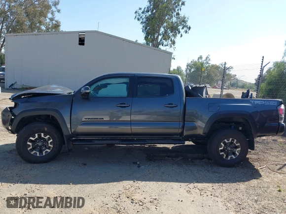 2021 Toyota Tacoma SR5 z VIN 3TMDZ5BN8MM117163, wystawiony jako IAAI lot #42070540 z przebiegiem 12 790 mil mil oraz . Historia ofert i sprzedaży dostępna na DreamBid. Obrazek 13.