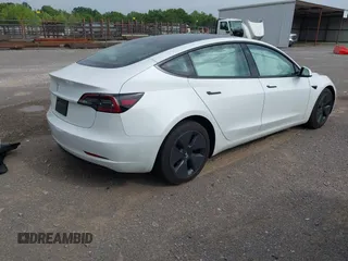 2023 Tesla Model 3 with VIN 5YJ3E1EA4PF644621, listed as a IAAI auction lot 42280312 with 41,262 mi miles and . Bid and sale history available at DreamBid. Image 4.
