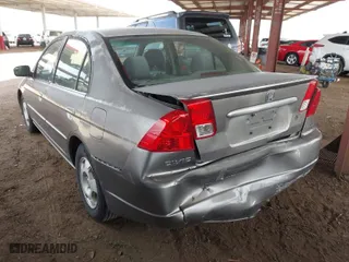 2004 Honda Civic Hybrid with VIN JHMES95654S018200, listed as a IAAI auction lot 41912912 with 291,301 mi miles. Bid and sale history available at carsss.com. Image 3.