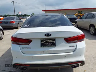 2016 Kia Optima SXL Turbo with VIN 5XXGV4L26GG015874, listed as a IAAI auction lot 42127366 with 166,970 mi miles. Bid and sale history available at carsss.com. Image 16.