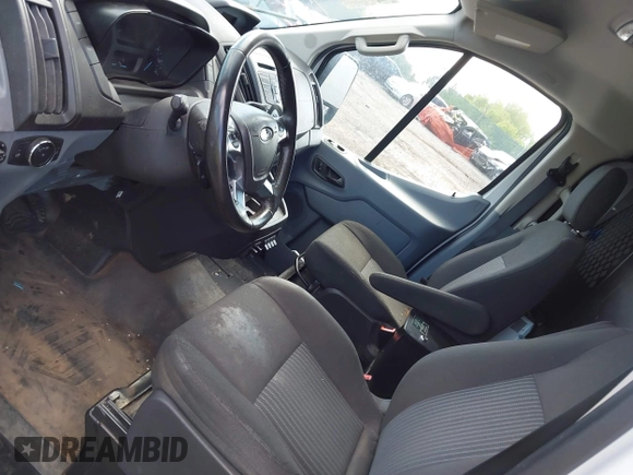 2016 Ford Transit Cargo z VIN 1FTYR1YM0GKB55605, wystawiony jako IAAI lot #42211489 z przebiegiem Nie podano mil oraz . Historia ofert i sprzedaży dostępna na DreamBid. Obrazek 19.