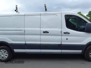 2016 Ford Transit Cargo z VIN 1FTYR2ZM6GKA03946, wystawiony jako IAAI lot #42590477 z przebiegiem 163 710 mil mil oraz . Historia ofert i sprzedaży dostępna na DreamBid. Obrazek 13.
