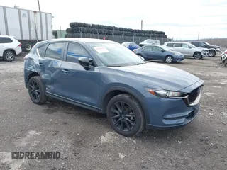 2021 Mazda CX-5 Touring with VIN JM3KFBCM5M0483547, listed as a IAAI auction lot 41683694 with 55,791 mi miles. Bid and sale history available at carsss.com. Image 1.
