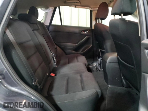 2016 Mazda CX-5 Touring z VIN JM3KE4CY5G0852073, wystawiony jako Copart lot #56599055 z przebiegiem 72 167 mil mil oraz Szkoda całkowita • Salvage title. Historia ofert i sprzedaży dostępna na DreamBid. Obrazek 11.