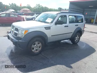 2007 Dodge Nitro SXT z VIN 1D8GU28KX7W616544, wystawiony jako IAAI lot #42251443 z przebiegiem 160 308 mil mil oraz . Historia ofert i sprzedaży dostępna na DreamBid. Obrazek 2.