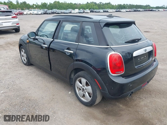 2015 MINI Hardtop 4 Door z VIN WMWXS5C58FT828427, wystawiony jako IAAI lot #42395620 z przebiegiem 102 282 mil mil oraz . Historia ofert i sprzedaży dostępna na DreamBid. Obrazek 3.
