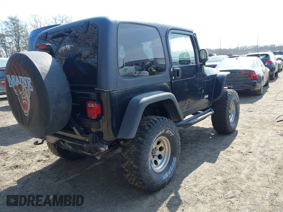 2004 Jeep Wrangler Rubicon with VIN 1J4FA69S64P789308, listed as a IAAI auction lot 41714489 with 186,302 mi miles. Bid and sale history available at carsss.com. Image 4.
