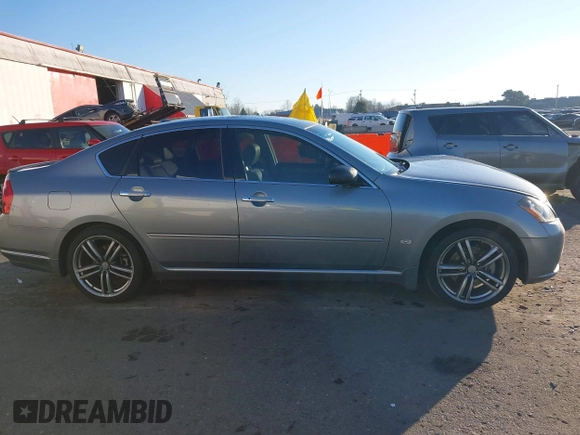 2006 Infiniti M z VIN JNKAY01E56M107083, wystawiony jako IAAI lot #41443347 z przebiegiem 162 191 mil mil oraz . Historia ofert i sprzedaży dostępna na DreamBid. Obrazek 13.