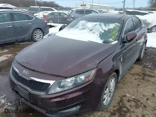 2011 Kia Optima EX with VIN KNAGN4A75B5158176, listed as a IAAI auction lot 41553536 with 140,785 mi miles. Bid and sale history available at carsss.com. Image 2.