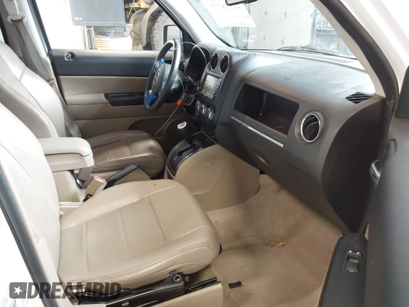 2014 Jeep Patriot Latitude with VIN 1C4NJPFA0ED680509, listed as a IAAI auction lot 41801775 with 147,418 mi miles and . Bid and sale history available at carsss.com. Image 5.