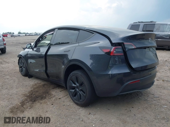 2025 Tesla Model Y Long Range with VIN 7SAYGDED7SA373235, listed as a IAAI auction lot 42100950 with 650 mi miles and . Bid and sale history available at DreamBid. Image 3.