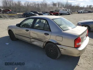 2002 Mazda Protege DX with VIN JM1BJ225520525472, listed as a Copart auction lot 45699915 with 183,457 mi miles and Salvage Title. Bid and sale history available at DreamBid. Image 2.