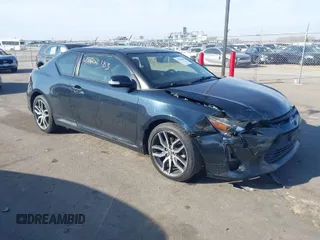 2015 Scion tC with VIN JTKJF5C71F3090963, listed as a IAAI auction lot 41802183 with 107,650 mi miles. Bid and sale history available at carsss.com. Image 1.