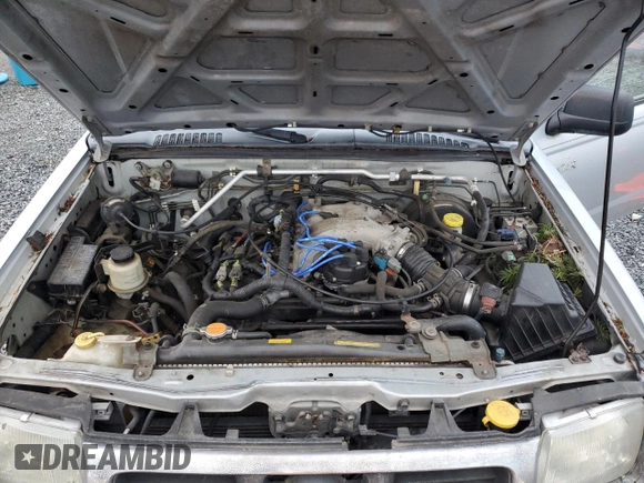 2000 Nissan Frontier XE z VIN 1N6ED27Y8YC368144, wystawiony jako Copart lot #87784565 z przebiegiem Nie podano mil oraz Czysty tytuł • Clean title. Historia ofert i sprzedaży dostępna na DreamBid. Obrazek 11.