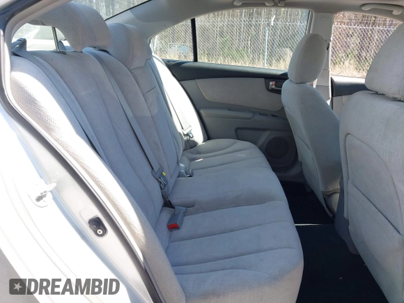2007 Kia Optima EX with VIN KNAGE124975157963, listed as a IAAI auction lot 41673886 with 128,278 mi miles. Bid and sale history available at carsss.com. Image 8.