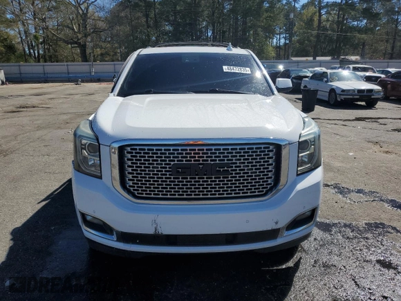 2015 GMC Yukon Denali with VIN 1GKS1CKJ9FR566390, listed as a Copart auction lot 48472835 with 167,719 mi miles and Salvage Title. Bid and sale history available at carsss.com. Image 5.