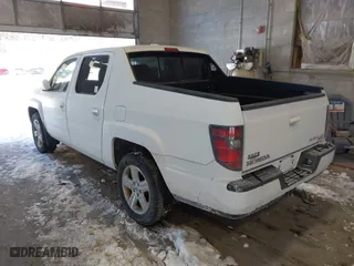 2014 Honda Ridgeline RTL with VIN 5FPYK1F55EB012490, listed as a IAAI auction lot 41391884 with 130,121 mi miles. Bid and sale history available at carsss.com. Image 3.