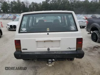 1996 Jeep Cherokee SE z VIN 1J4FJ28S7TL256478, wystawiony jako Copart lot #47164985 z przebiegiem 195 800 mil mil oraz Nie do naprawy • Non repairable. Historia ofert i sprzedaży dostępna na DreamBid. Obrazek 6.