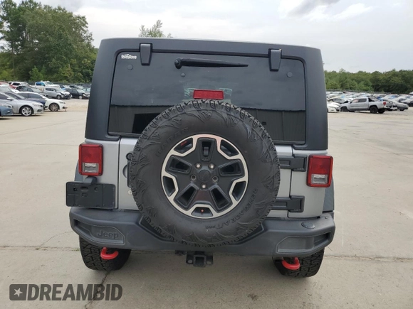 2013 Jeep Wrangler Unlimited Rubicon 10th Anniversary z VIN 1C4HJWFG3DL703331, wystawiony jako Copart lot #70823154 z przebiegiem 148 860 mil mil oraz Szkoda całkowita • Salvage title. Historia ofert i sprzedaży dostępna na DreamBid. Obrazek 6.