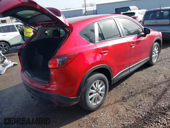 2016 Mazda CX-5 Sport with VIN JM3KE2BY3G0754391, listed as a IAAI auction lot 41719461 with 79,130 mi miles. Bid and sale history available at carsss.com. Image 4.