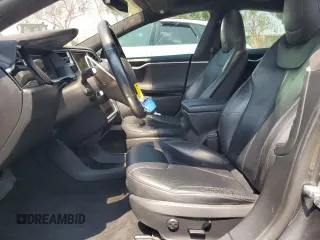 2014 Tesla Model S 60 z VIN 5YJSA1H11EFP64764, wystawiony jako Copart lot #64265815 z przebiegiem 126 191 mil mil oraz Szkoda całkowita • Salvage title. Historia ofert i sprzedaży dostępna na DreamBid. Obrazek 7.