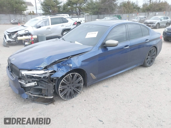 2018 BMW 5 Series M550i xDrive with VIN WBAJB9C56JG463891, listed as a IAAI auction lot 41731556 with 104,860 mi miles. Bid and sale history available at carsss.com. Image 17.