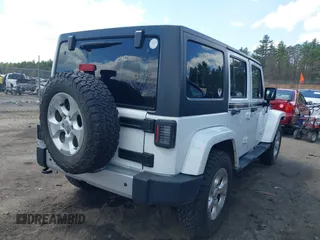 2015 Jeep Wrangler Unlimited Sahara with VIN 1C4HJWEG6FL556460, listed as a IAAI auction lot 42066648 with 54,747 mi miles. Bid and sale history available at carsss.com. Image 4.