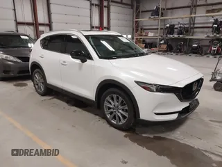 2020 Mazda CX-5 Grand Touring with VIN JM3KFBDM6L1828611, listed as a IAAI auction lot 42006976 with 59,939 mi miles and . Bid and sale history available at DreamBid. Image 1.