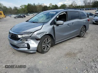 2022 Honda Odyssey Touring z VIN 5FNRL6H84NB048704, wystawiony jako Copart lot #52301035 z przebiegiem 91 429 mil mil oraz Czysty tytuł • Clean title. Historia ofert i sprzedaży dostępna na DreamBid. Obrazek 1.