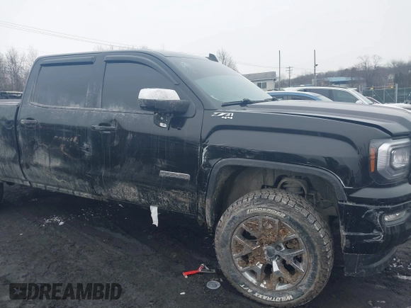 2018 GMC Sierra 1500 SLE z VIN 3GTU2MEC8JG249701, wystawiony jako IAAI lot #41556135 z przebiegiem 87 657 mil mil oraz . Historia ofert i sprzedaży dostępna na DreamBid. Obrazek 6.