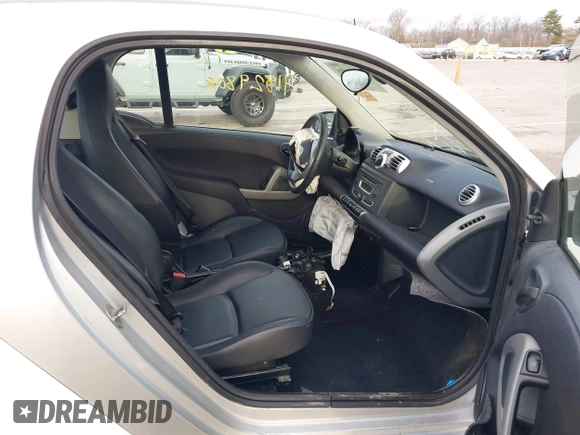 2013 Smart fortwo Pure with VIN WMEEJ3BA2DK702004, listed as a IAAI auction lot 41829808 with 53,545 mi miles and . Bid and sale history available at DreamBid. Image 5.
