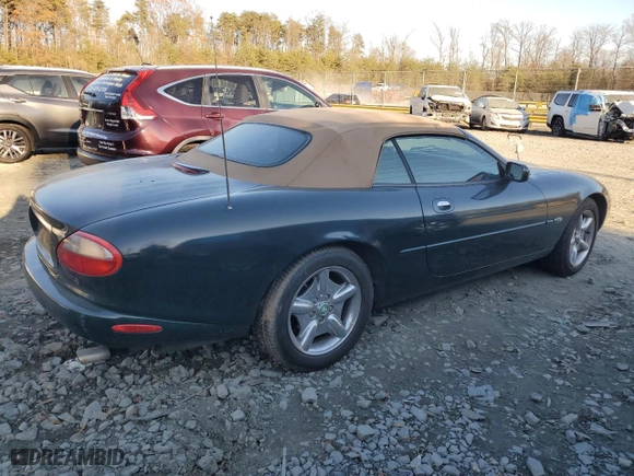 1997 Jaguar XK8 with VIN SAJGX2744VC004848, listed as a Copart auction lot 83250824 with NaN miles and Salvage Title. Bid and sale history available at carsss.com. Image 3.