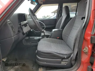 1999 Jeep Cherokee Sport with VIN 1J4FT68S2XL580915, listed as a Copart auction lot 50374875 with 286,276 mi miles and Salvage Title. Bid and sale history available at carsss.com. Image 7.