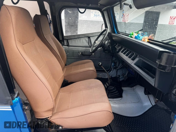 1992 Jeep Wrangler z VIN 2J4FY19P6NJ559597, wystawiony jako Copart lot #81398954 z przebiegiem 150 310 mil mil oraz Szkoda całkowita • Salvage title. Historia ofert i sprzedaży dostępna na DreamBid. Obrazek 5.