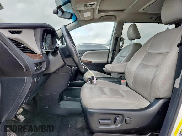 2015 Toyota Sienna XLE with VIN 5TDYK3DC4FS617099, listed as a Copart auction lot 61128025 with 114,508 mi miles and Salvage title. Bid and sale history available at DreamBid. Image 7.